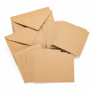 Recycled kraft envelopes and blank cards on a white background